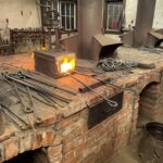 Heating the iron for firepalce pokers, in a forge