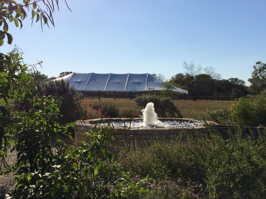 Tent picturesquely positioned behind the Gristmill water fountain